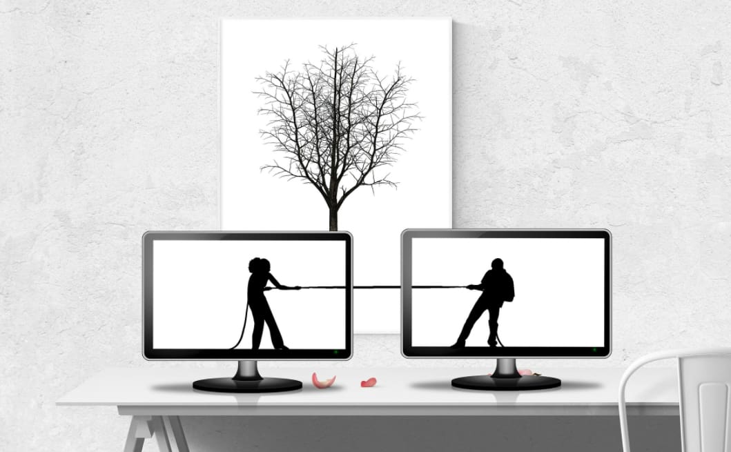 A couple pulling a rope in opposite directions, symbolizing conflict and tension, with a focus on resolution through mediation in Sydney A couple pulling a rope in opposite directions, symbolizing conflict and tension, with a focus on resolution through mediation in Sydney